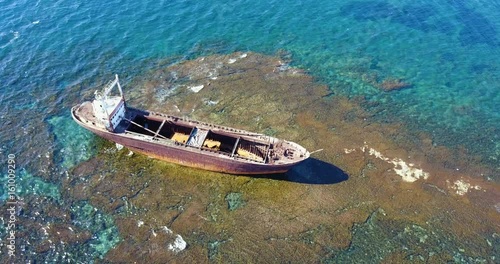 Wallpaper Mural  Beautiful seascape with old big, broken, rusty boat near the coast of Peyia, Cyprus. Ship graveyard. Famous landmark in the Mediterranean sea. Torontodigital.ca