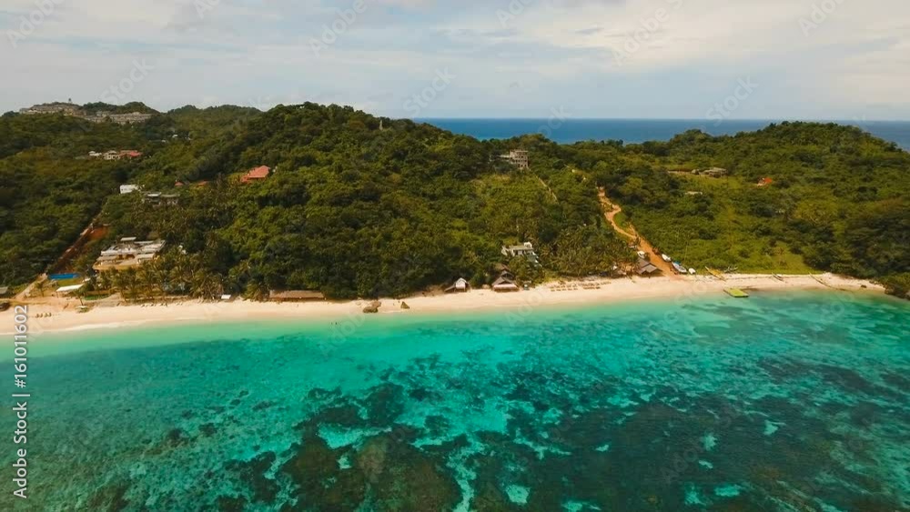 Aerial view of beautiful tropical island with white sand beach, hotels and tourists. Tropical lagoon with turquoise water and white sand. Beautiful sky, sea, beach, resort. Beautiful tropical beach of Aerial view of beautiful tropical island with white sand beach, hotels and tourists. Tropical lagoon with turquoise water and white sand. Beautiful sky, sea, beach, resort. Beautiful tropical beach of