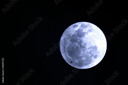 Full moon in dark background Image of a full moon against a black background