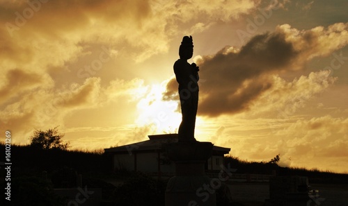 Photography Silhouette of a statue at sunset, Banzai Cliff, Saipan  A statue at the memorial