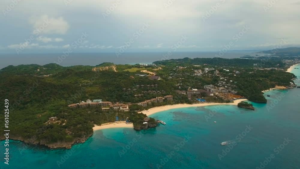 Aerial view of beautiful tropical island with white sand beach, hotels and tourists. Tropical lagoon with turquoise water and white sand. Beautiful sky, sea, beach, resort. Beautiful tropical beach of Aerial view of beautiful tropical island with white sand beach, hotels and tourists. Tropical lagoon with turquoise water and white sand. Beautiful sky, sea, beach, resort. Beautiful tropical beach of