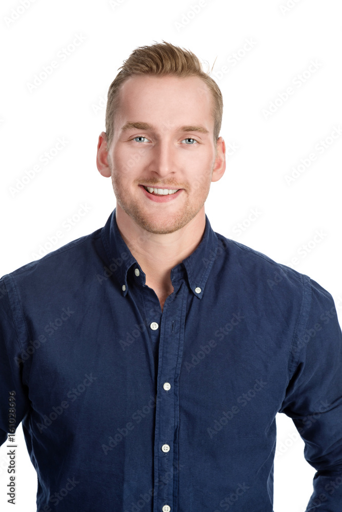 Handsome blonde man standing against a white background wearing a blue shirt and jeans. Handsome blonde man standing against a white background wearing a blue shirt and jeans.