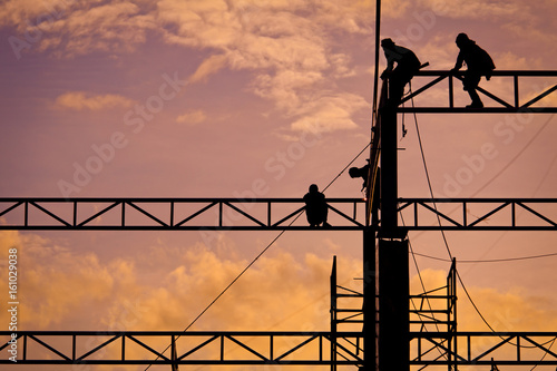 Workers working at twilight