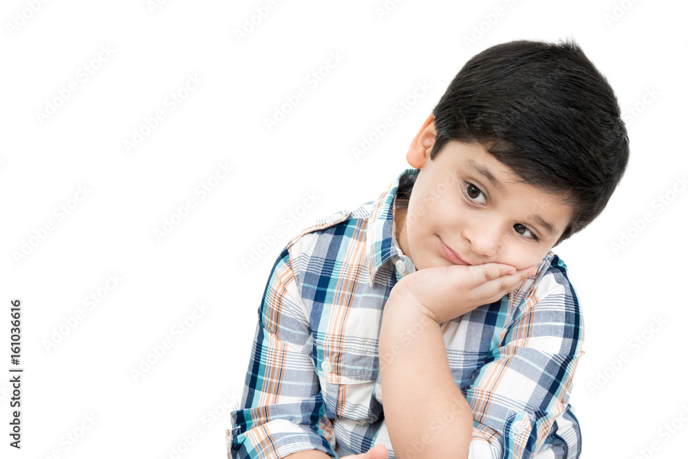 Smiling cute Asian boy with hand on cheek Smiling cute Asian boy with hand on cheek