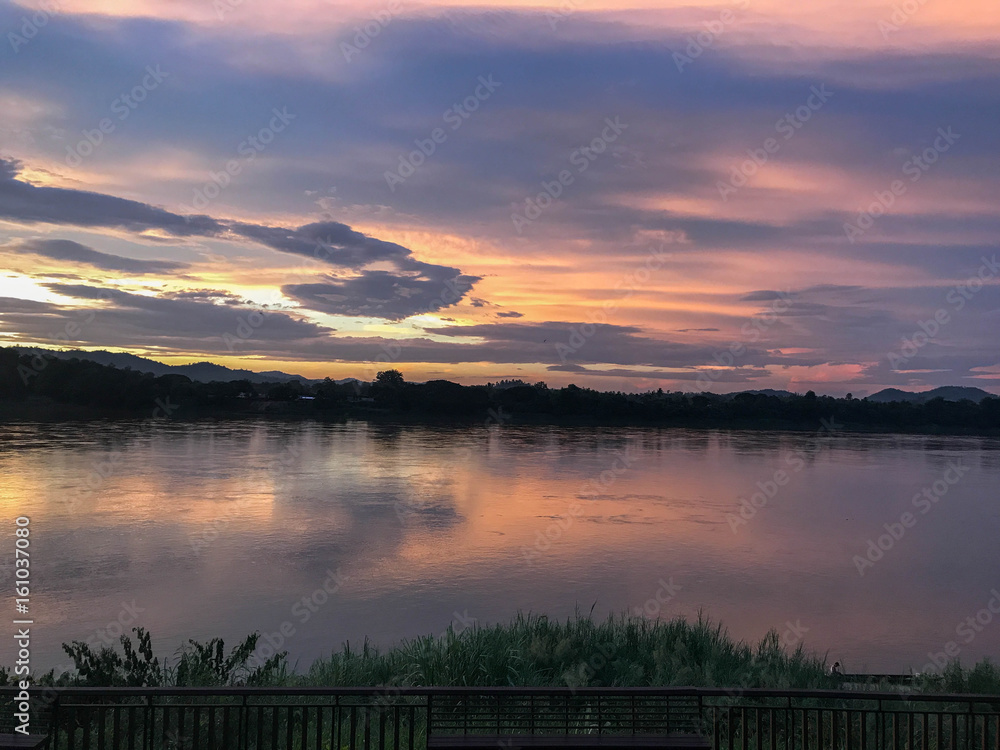 Sunset reflecting on river Thailand