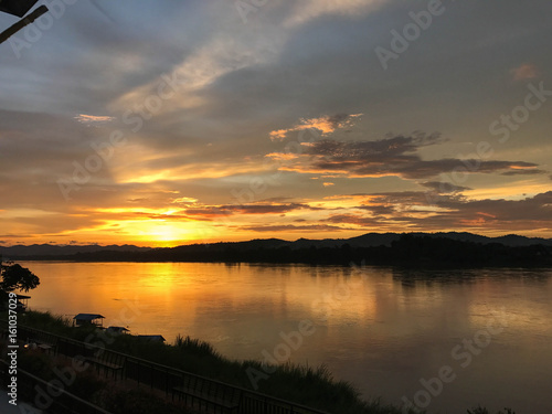 Sunset reflecting on river Thailand © AKABUSH