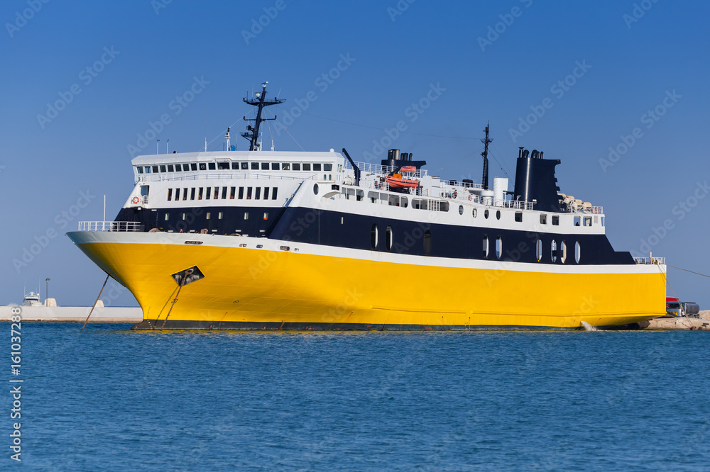 Yellow passenger ferry moored in port