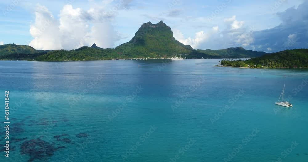 Aerial view of Bora Bora in French Polynesia with coral lagoon and Mount Otemanu Mt Pahia, Mount Otemanu, Tahiti, south Pacific Ocean. Boat and cruise ship. Aerial view of Bora Bora in French Polynesia with coral lagoon and Mount Otemanu Mt Pahia, Mount Otemanu, Tahiti, south Pacific Ocean. Boat and cruise ship.
