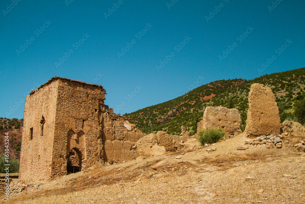 ruin of a kasbah against sky in a sunny day - bine el ouidane - morocco