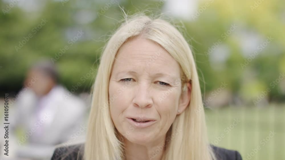 Mature business woman talking to camera, pov of video call Mature business woman talking to camera, pov of video call