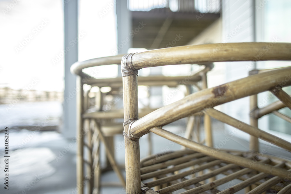 Cane Chair outside on wooden deck in winter Cane Chair outside on wooden deck in winter
