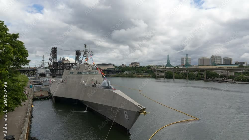 Time lapse of moving clouds and over USS Jackson Navy ship and Portland OR downtown cityscape during Rose Festival fleet week 4k uhd Time lapse of moving clouds and over USS Jackson Navy ship and Portland OR downtown cityscape during Rose Festival fleet week 4k uhd