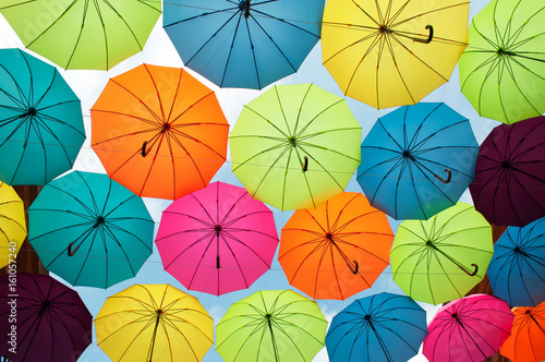 Bright and vivid umbrellas in the sky for background