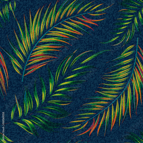 Exotic leaf seamless print on denim backdrop. Bright palm leaves on a dark blue background, color graphics, blue jeans texture, hand-drawn vector.
