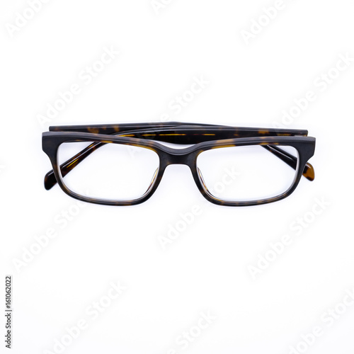 Closeup of a pair of glasses isolated on white background. Androgynous style in amber.