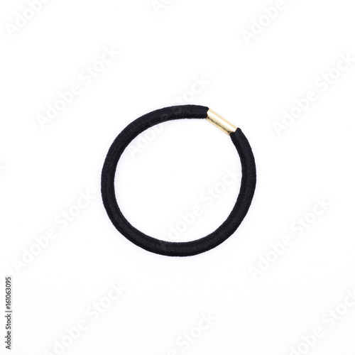 Closeup of a simple black hair band isolated on white background.