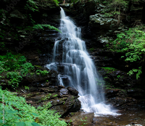 large waterfall silky smooth flowing over rocks