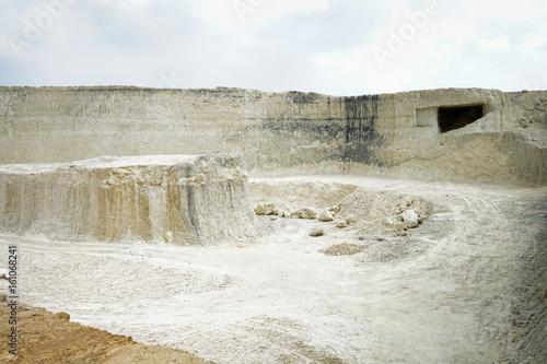 The exploitation of limestone hills forming a unique architectural in Jeddih or Jaddih Hill Madura Island, Indonesia photo