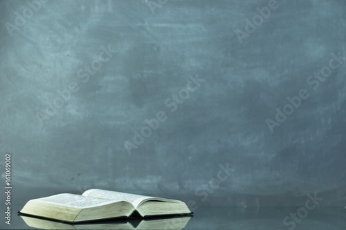 Bible on the old table. Beautiful background	 photo