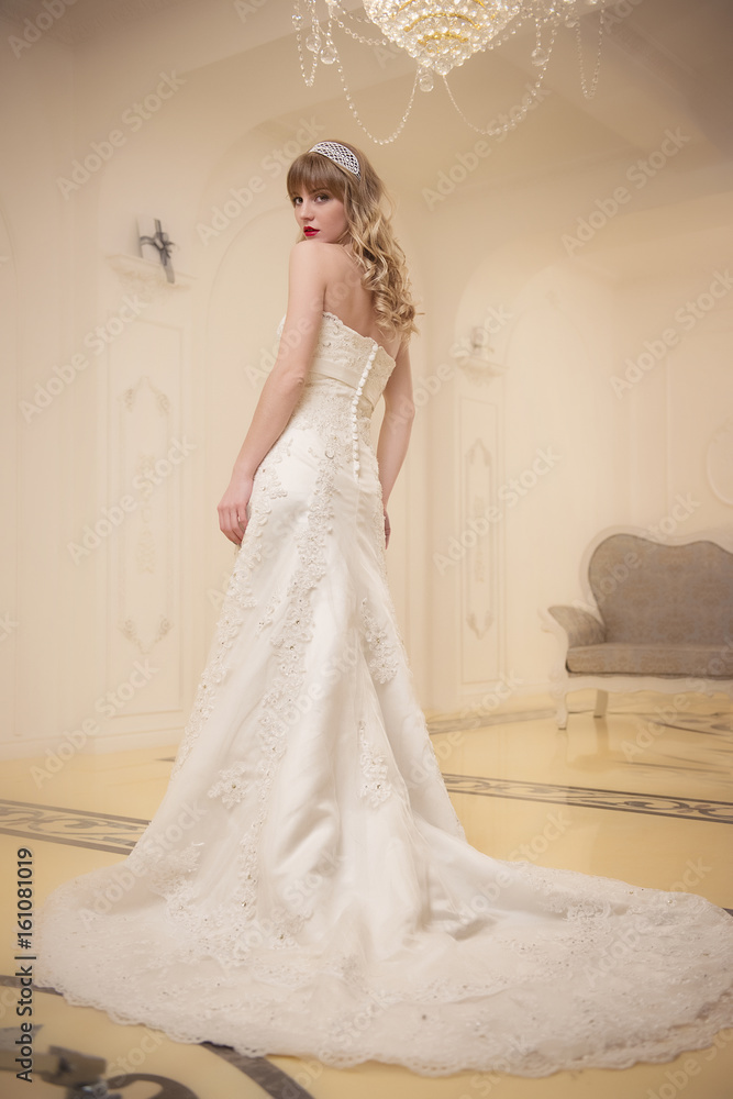 portrait of a girl in an elegant wedding dress in a bright room portrait of a girl in an elegant wedding dress in a bright room