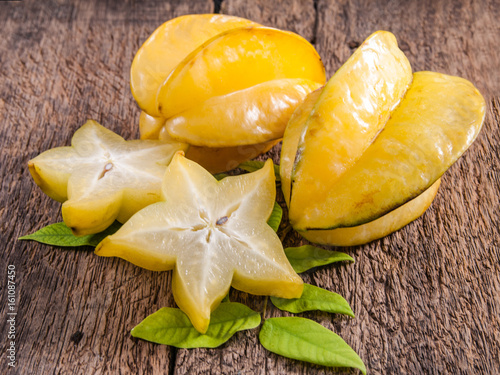 yellow star fruit or star apple on wood background