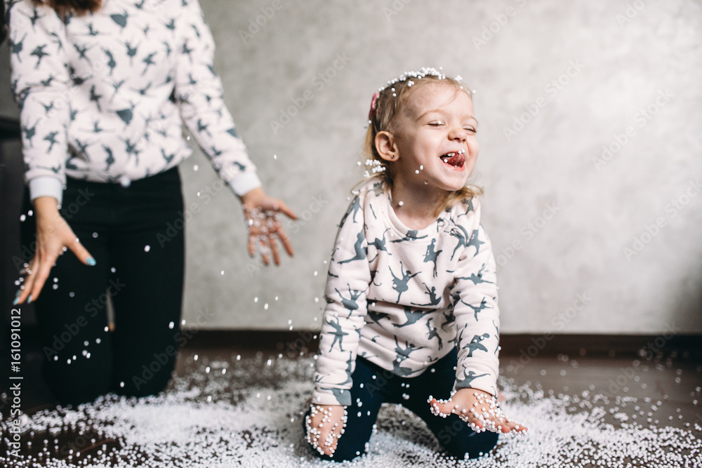 Little girl is playing with foam balls Little girl is playing with foam balls