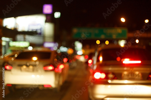 night light of traffic car on the city street, abstract blur bokeh background © sutichak