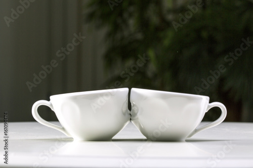 Two white cups on a gray background. I love uou.