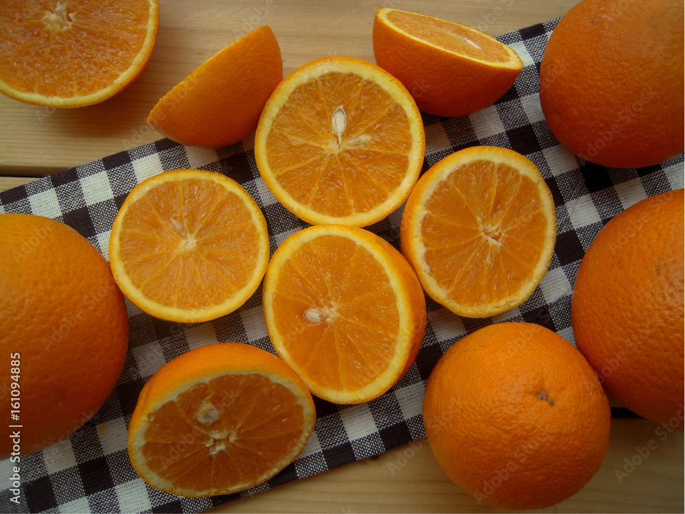 Oranges cut into halves, prepared for make juice. Oranges cut into halves, prepared for make juice.