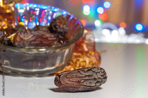 Ramadan, Eid concept background of Date fruit with illuminated out of focus lights