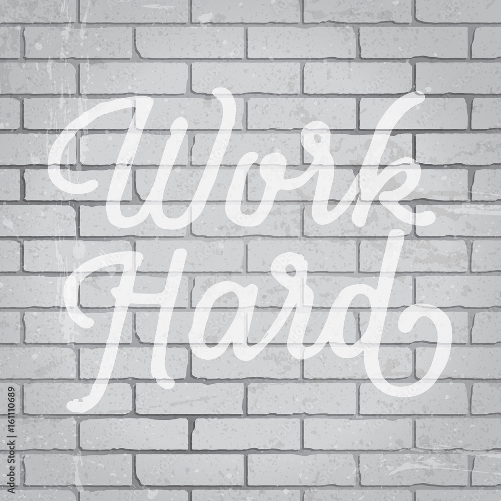 Hand drawn lettering slogan on brick wall background Hand drawn lettering slogan on brick wall background