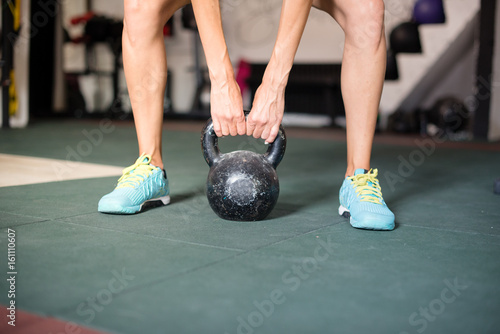 Woman exercise with kettle bells