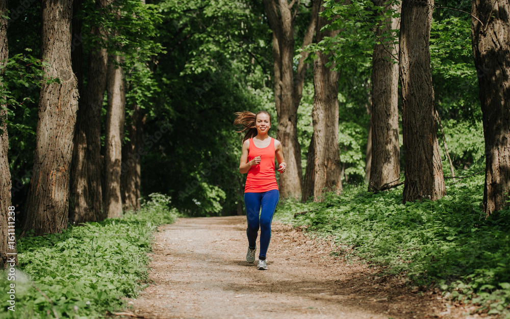 Young woman working out outdoors in park. Sport girl. Healthy life. Young woman working out outdoors in park. Sport girl. Healthy life.