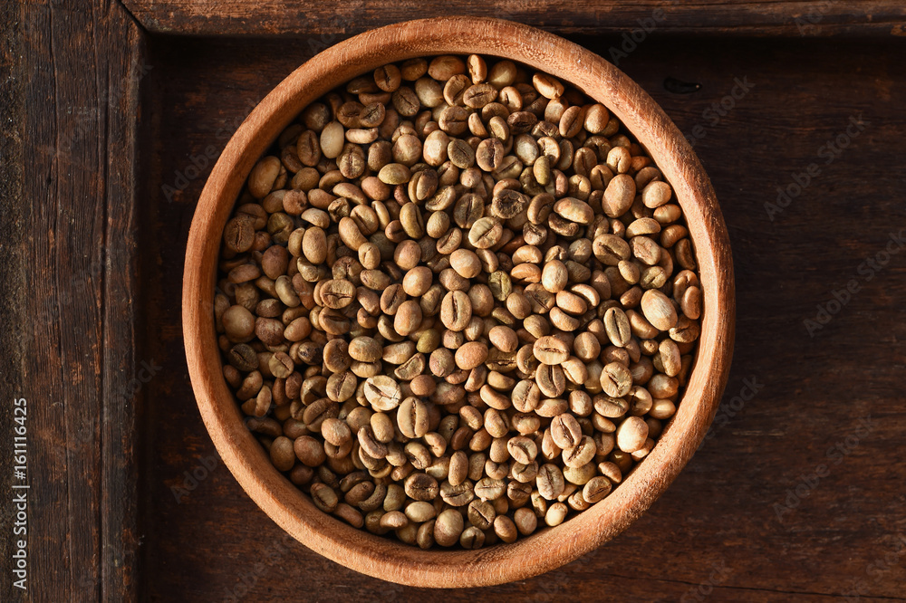 Freshly coffee beans in bowl for background Freshly coffee beans in bowl for background