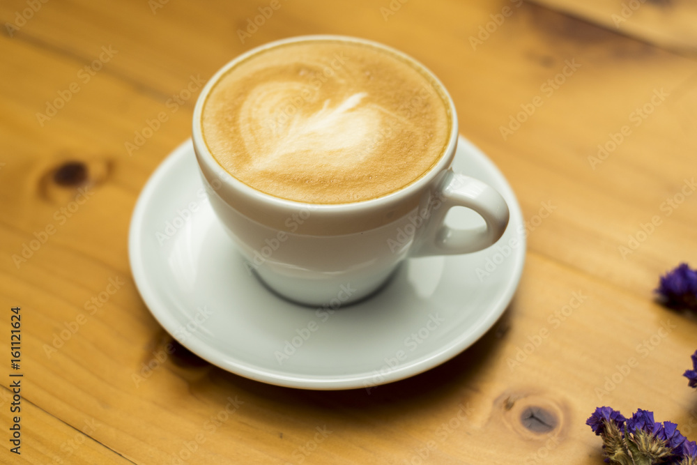 Obraz premium coffee cup on wood table