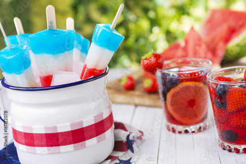 Red-white-and-blue popsicles on an outdoor table photo