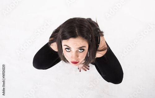girl crouching and looking up