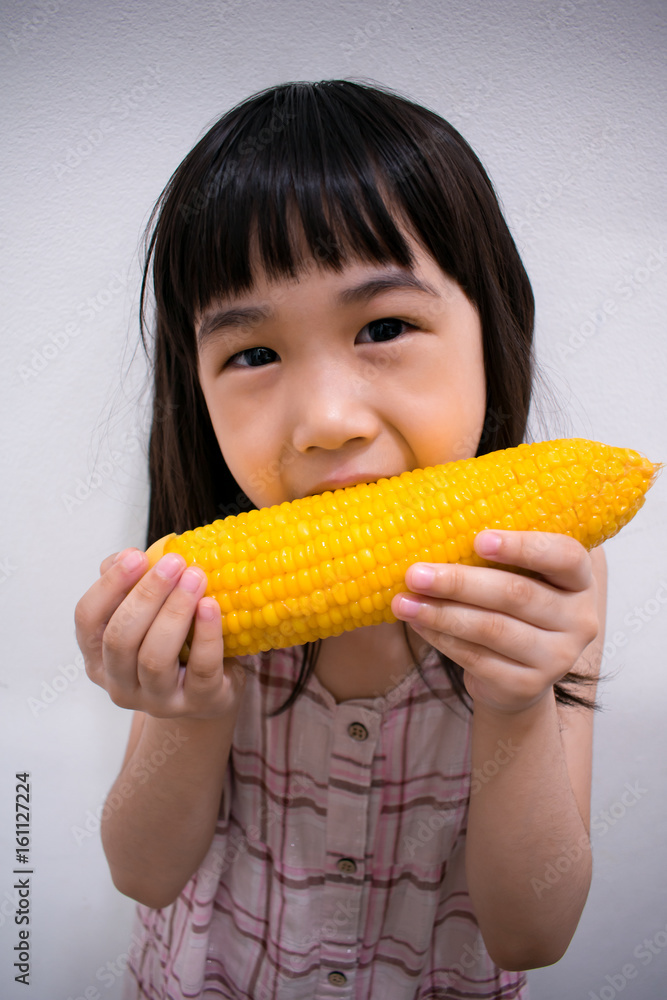 Child Eating a Corn Cob Child Eating a Corn Cob