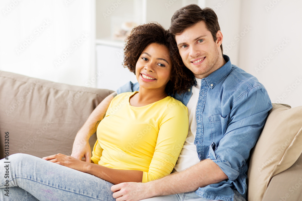 happy smiling international couple at home happy smiling international couple at home