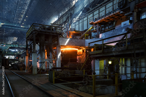 Metal smelting furnace in steel mills photo