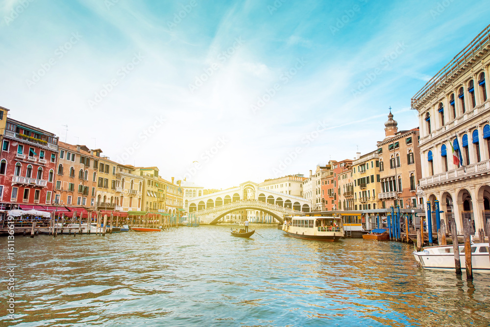A magical landscape with gondola on the Grand Canal on a sunny day in Venice, Italy, Europe. (Romantic travel, honeymoon - concept)