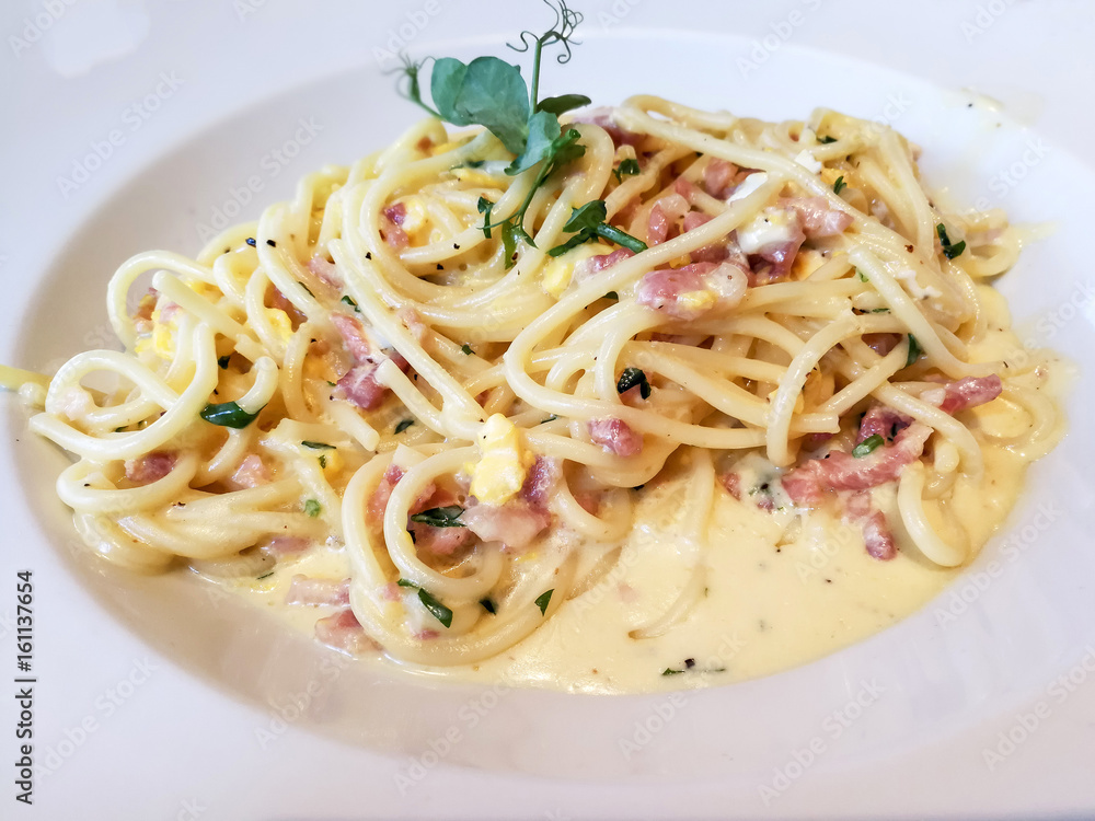 tasty pasta with roast ham on the table