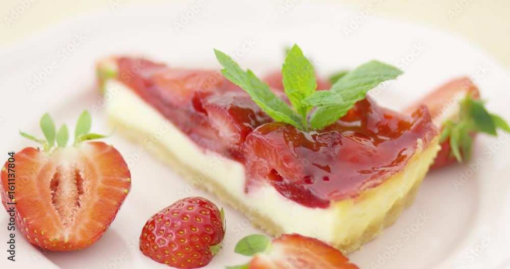 Close-up shot of tasty cheesecake slice with strawberries served on plate. Close-up shot of tasty cheesecake slice with strawberries served on plate.