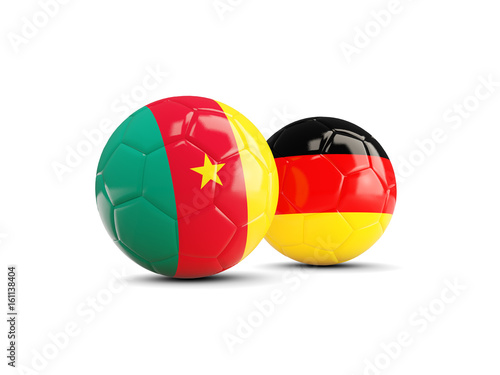 Two footballs with flags of Cameroon and Germany isolated on white