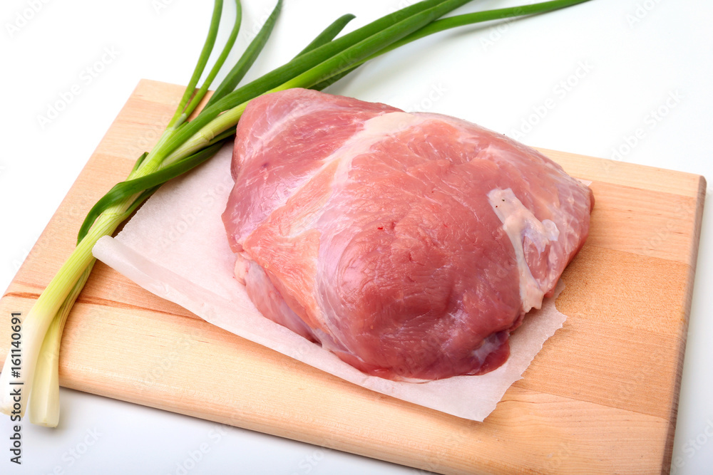 pork steaks with fat. Meat is on wooden board with spice as pepper and green spring onion. Ready for cooking. Selective focus. pork steaks with fat. Meat is on wooden board with spice as pepper and green spring onion. Ready for cooking. Selective focus.