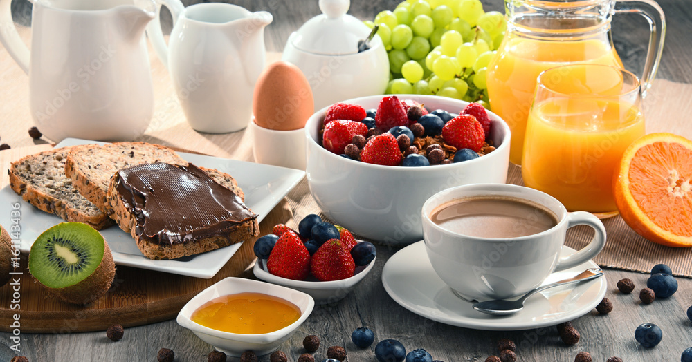 Breakfast served with coffee, juice, bread and fruits Breakfast served with coffee, juice, bread and fruits