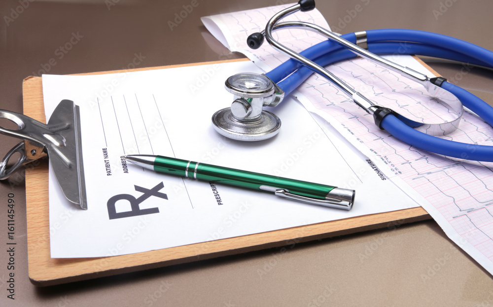 RX prescription, Red heart, asorted pils and a stethoscope on white background RX prescription, Red heart, asorted pils and a stethoscope on white background
