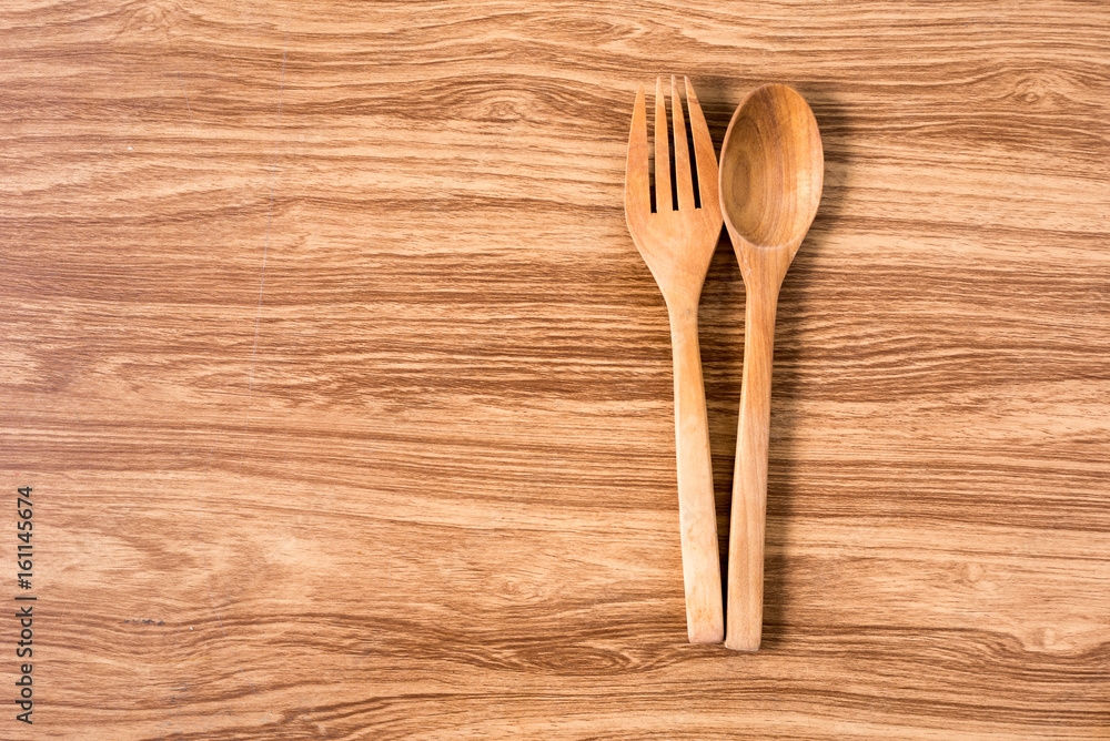 Wooden spoon and fork with wooden table. Wooden spoon and fork with wooden table.