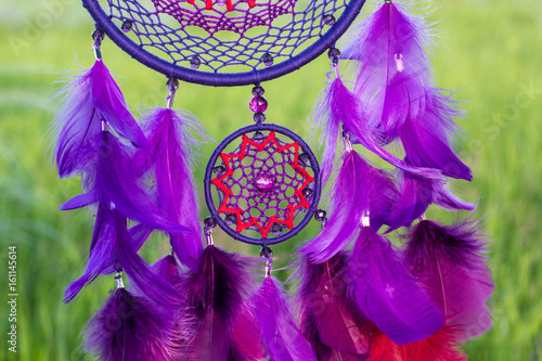 Dreamcatcher made of feathers  leather  beads  and ropes