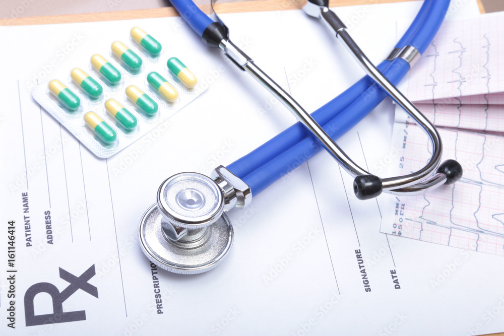 RX prescription, Red heart, asorted pils and a stethoscope on white background RX prescription, Red heart, asorted pils and a stethoscope on white background